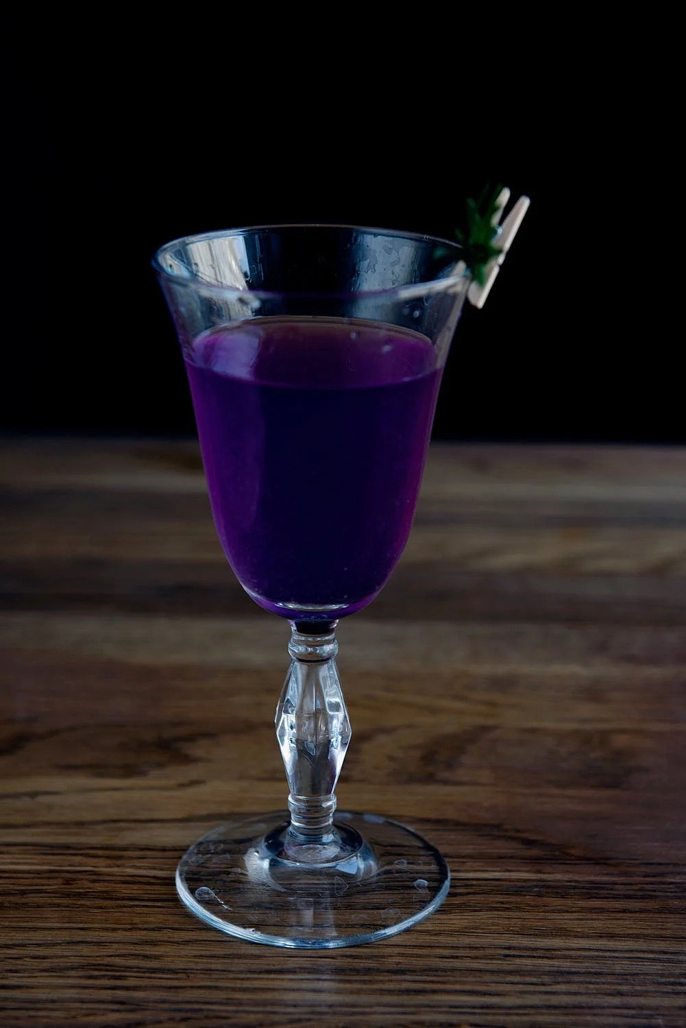 Glass of Berry Beret on a wooden table