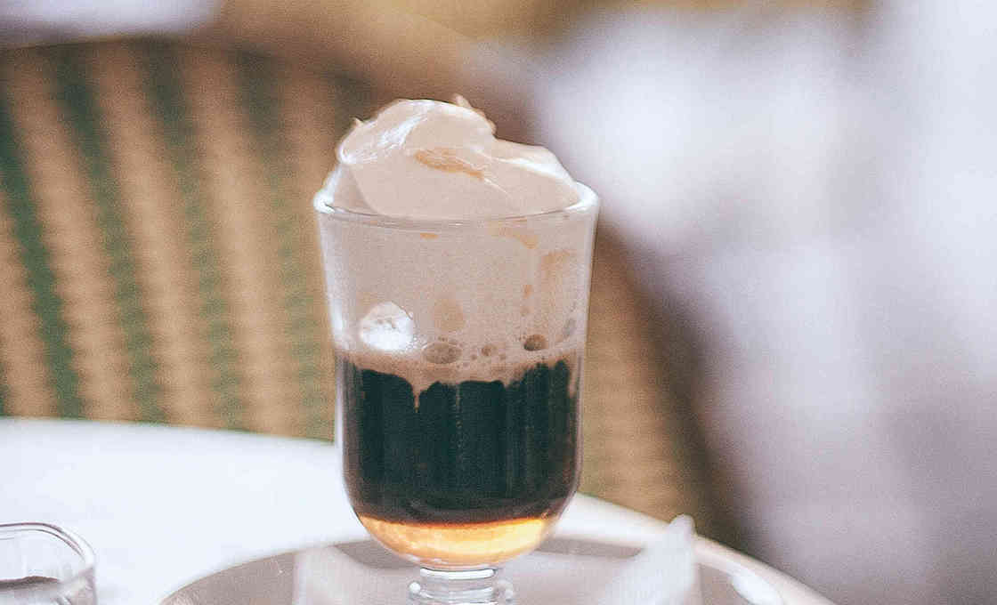 A glass filled with Irish Cream Chocolate Coffee and ice