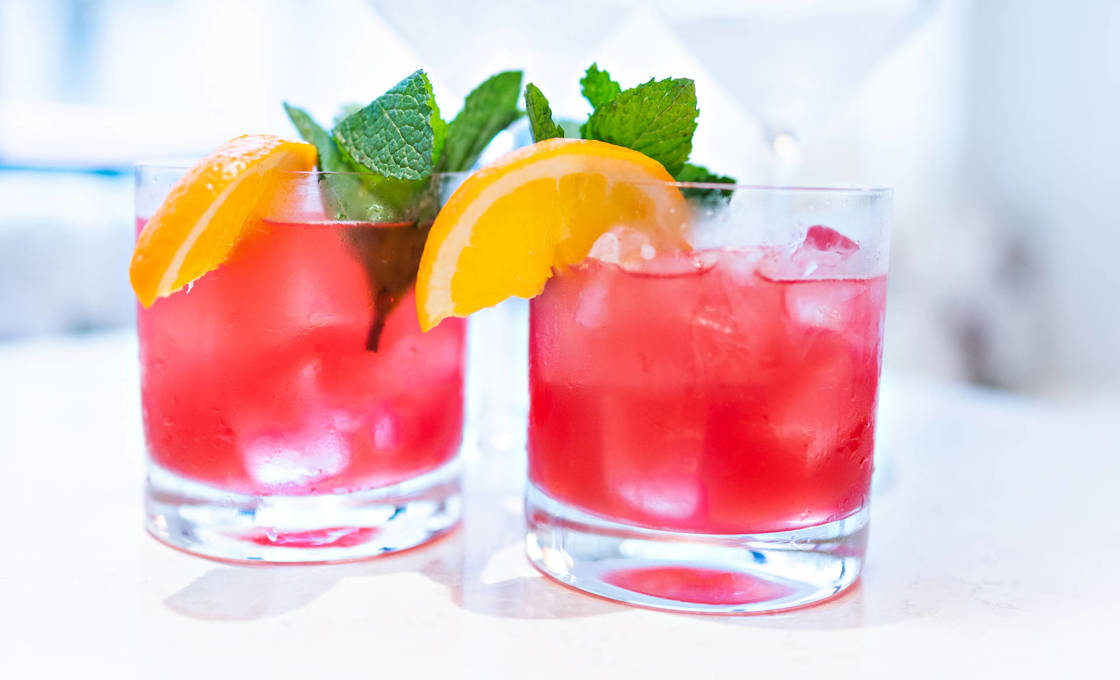 Two glasses of Pinky with lemon garnish