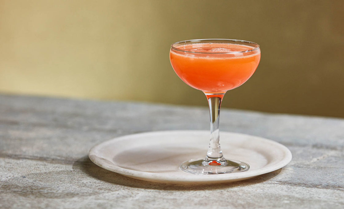 Glass of Pink Grapefruit Daiquiri on a plate