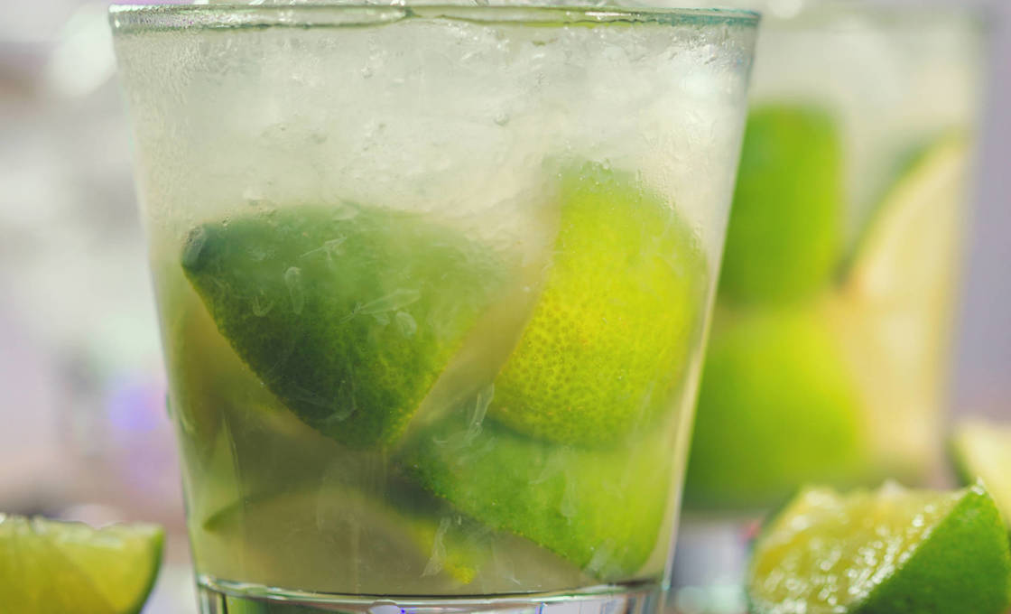 Sweet and refreshing Caipirinha national cocktail from Brazil made with lime,ice, sugar, and a sugarcane liquor