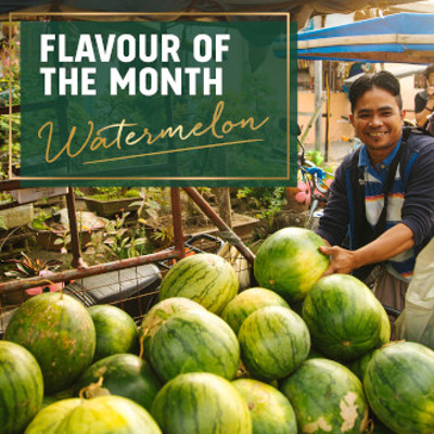 Flavour of the month - Watermelon - man with market stall of melons