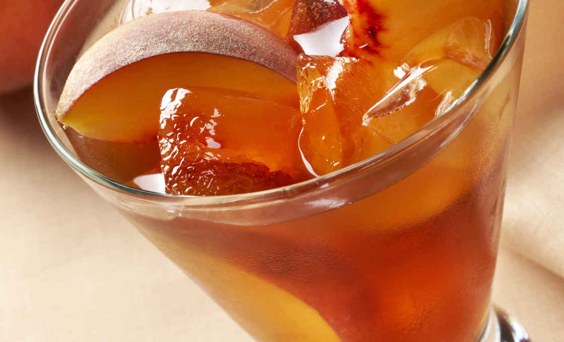 Close up of a glass of Peach Iced Tea
