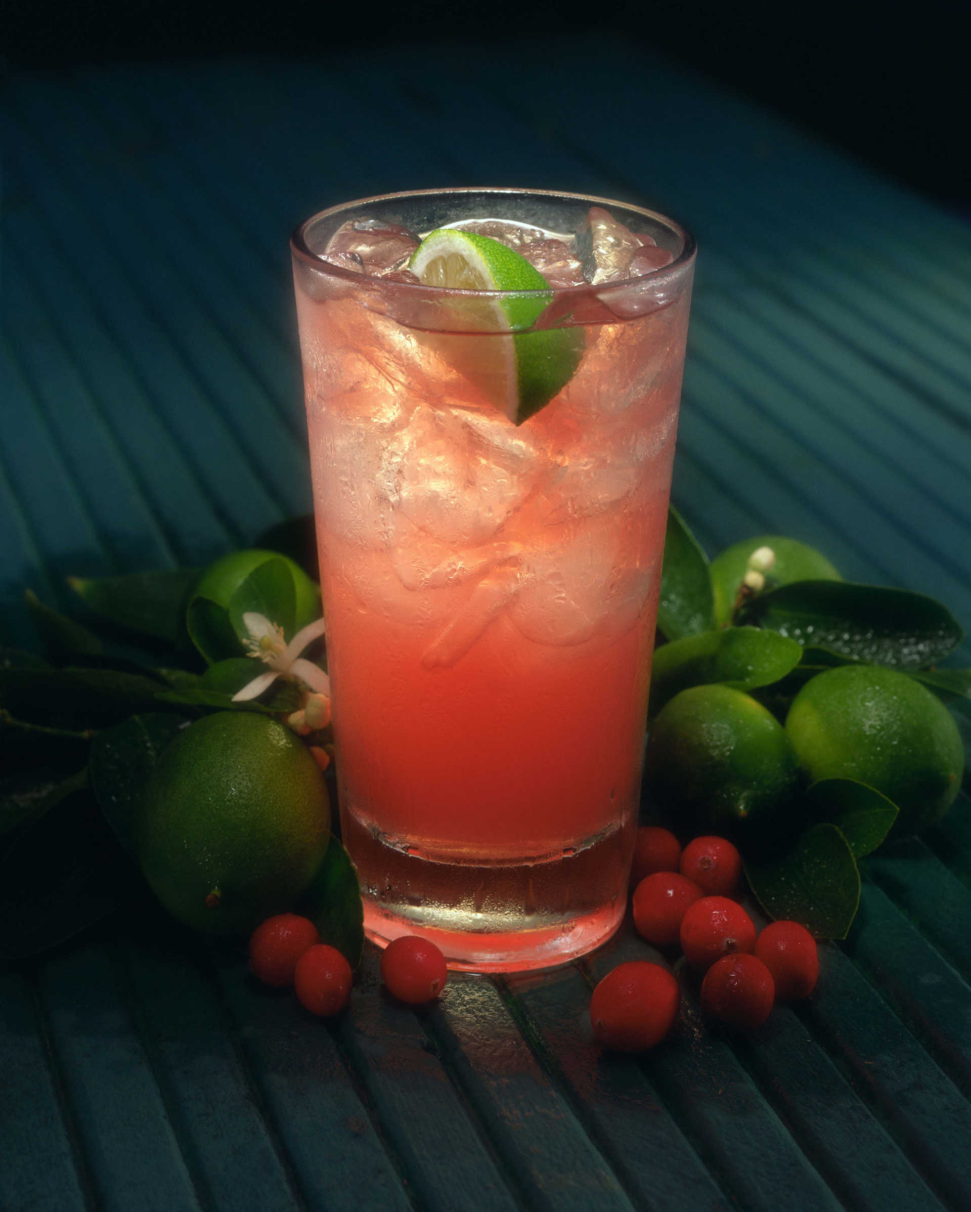 Summer Soda on a wooden surface with lime and other garnish