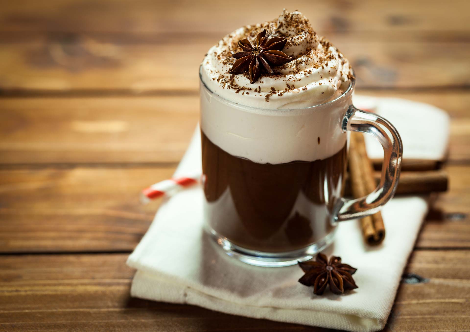 A glass of hot cocoa anise with chocolate sprinkled on top