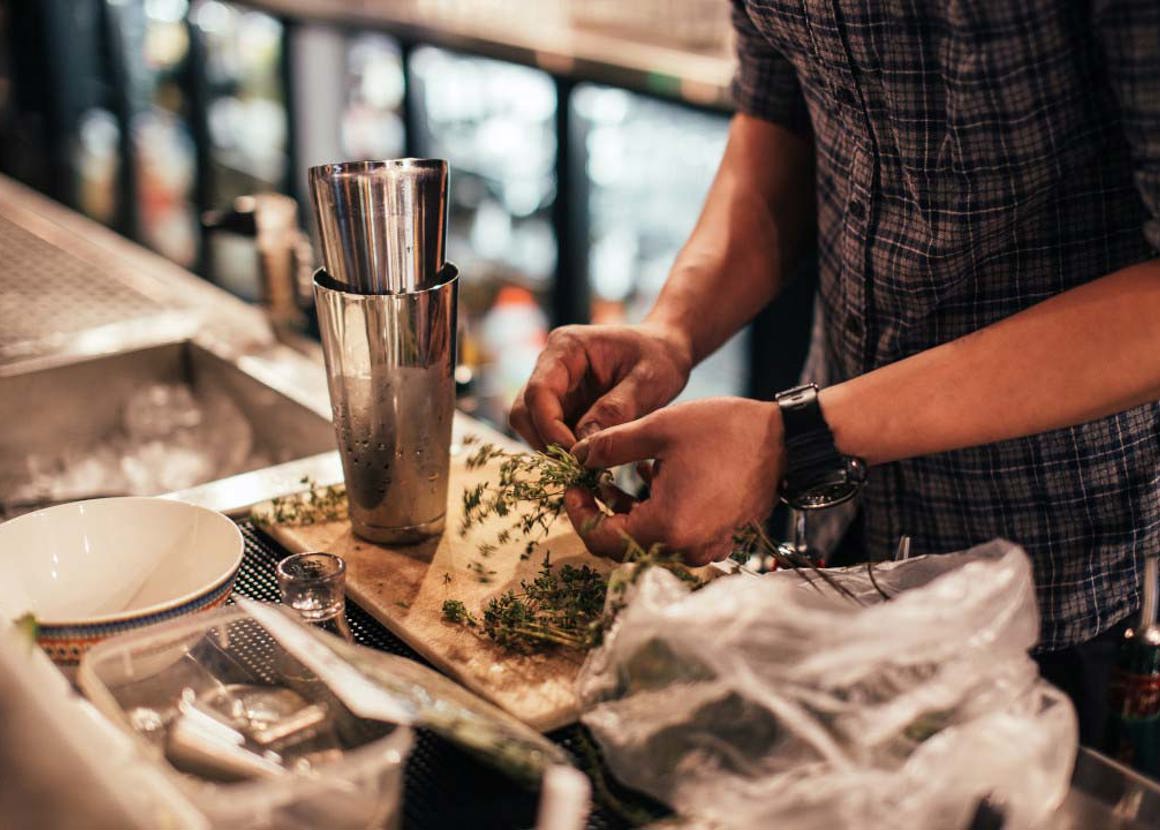 Bartender preparing garnish 