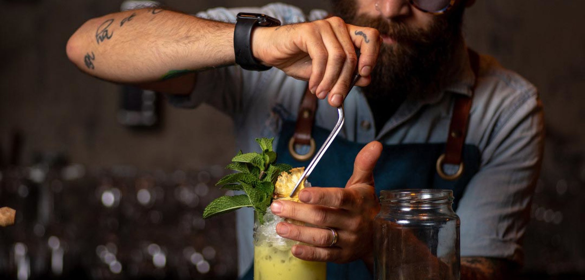 Bartender garnishing a drink