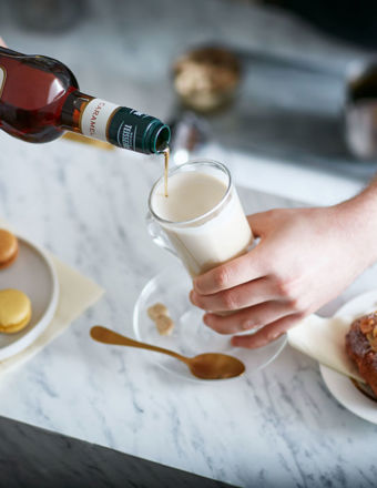 Man pouring Mathieu Teisseire syrup into a glass