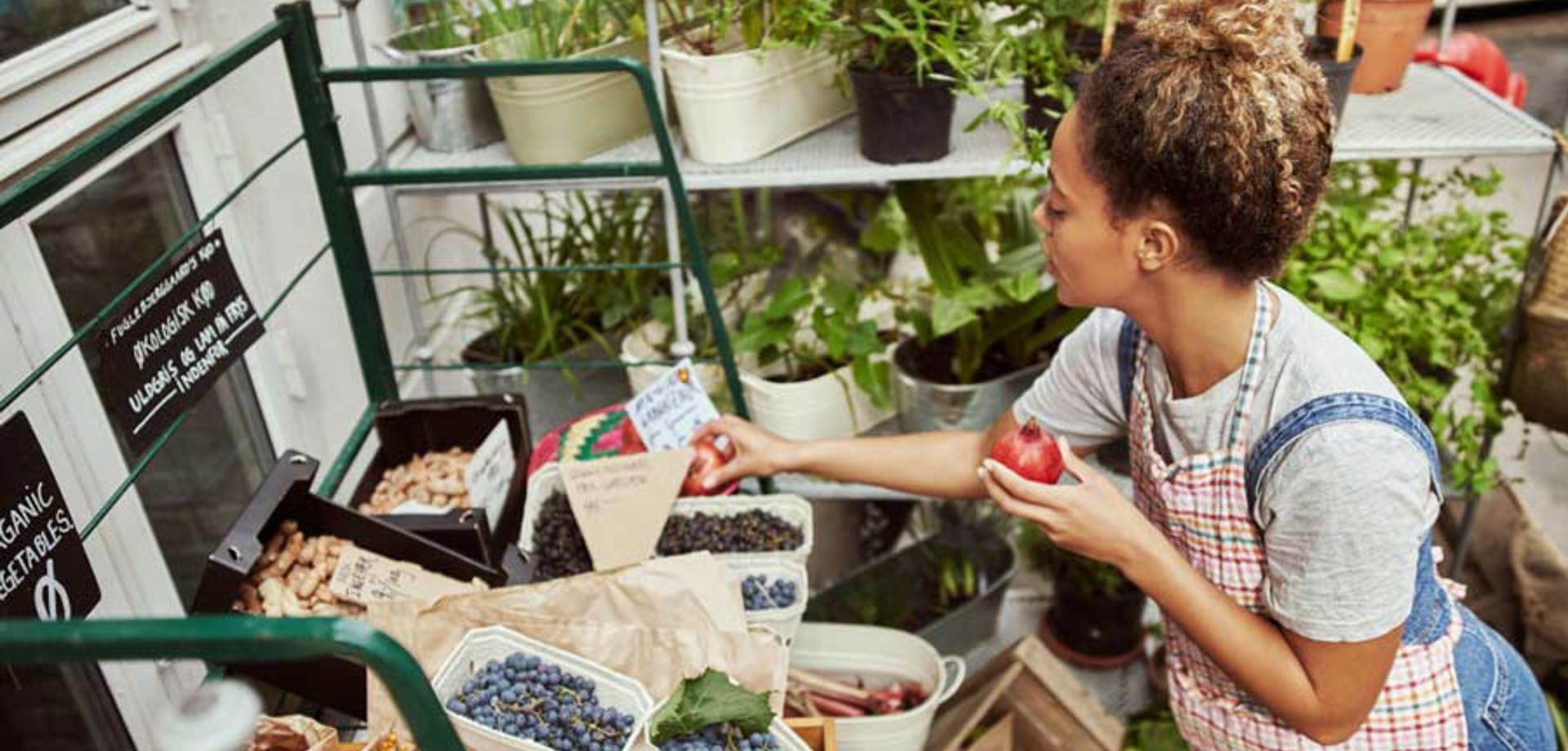 Lady organising fruit 