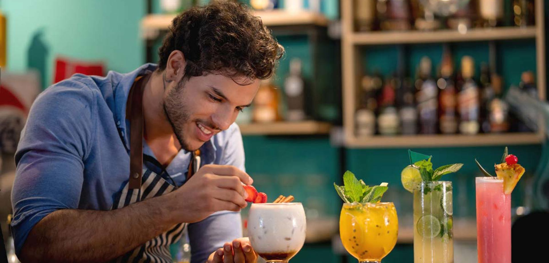 Barman Decorating Cocktails At The Bar