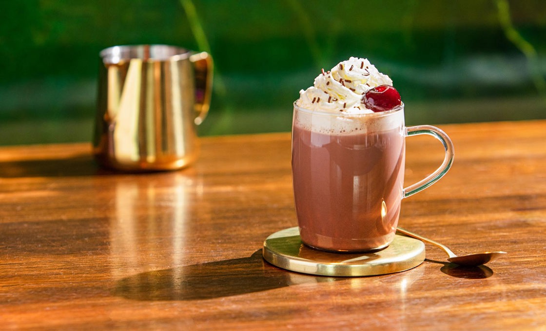 Black Forest Hot Chocolate in glass on table