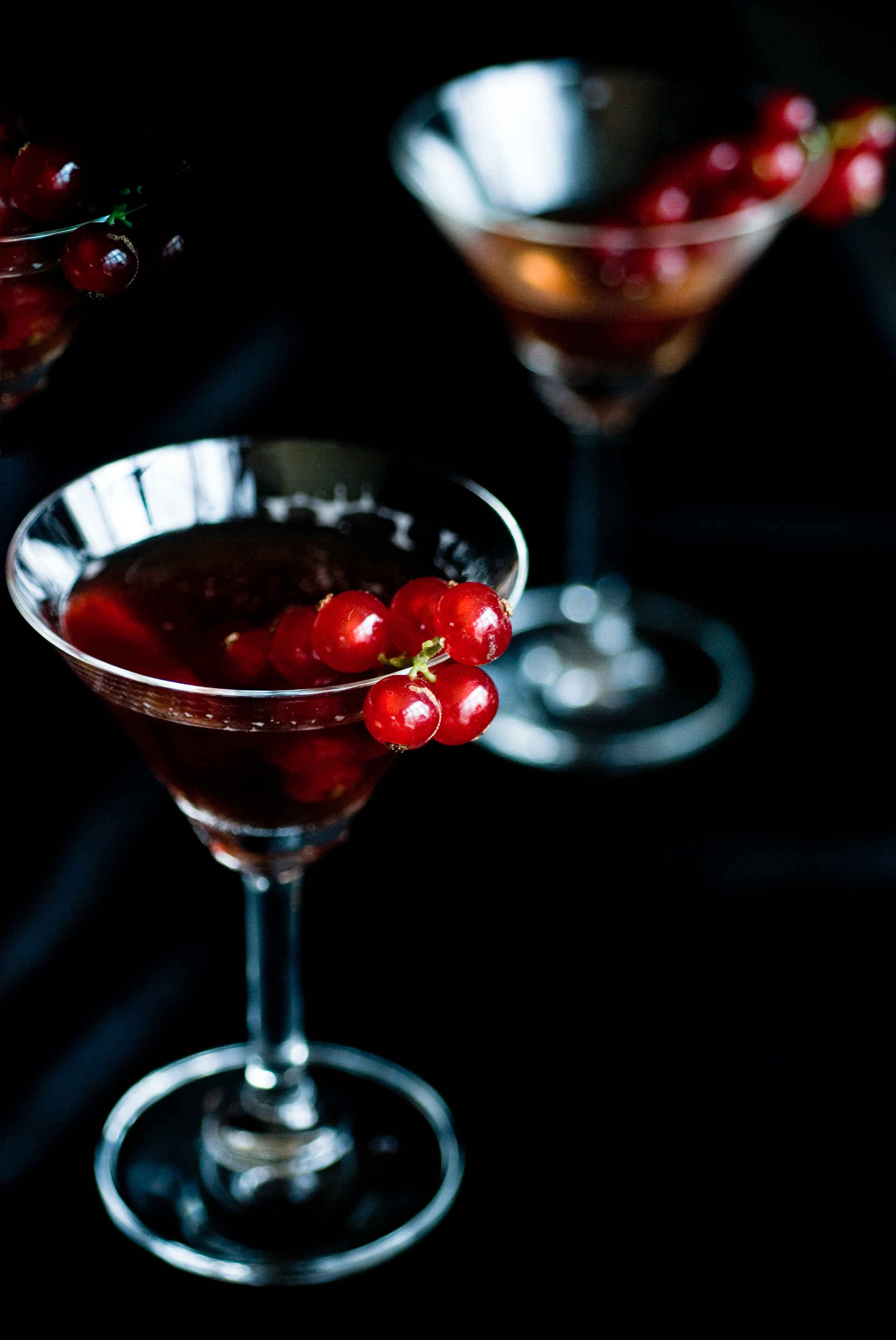Martini glass of Emeraude on a dark background